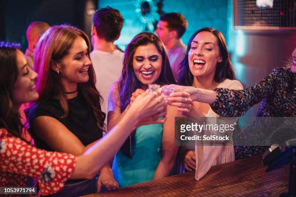 group of girls about to take some shots - tequila drink stock pictures, royalty-free photos & images