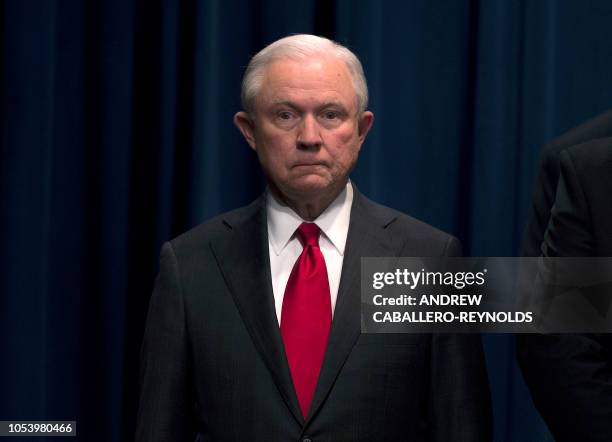 Attorney General Jeff Sessions looks on during a press conference regarding the arrest of bombing suspect Cesar Sayoc in Florida, at the Department...