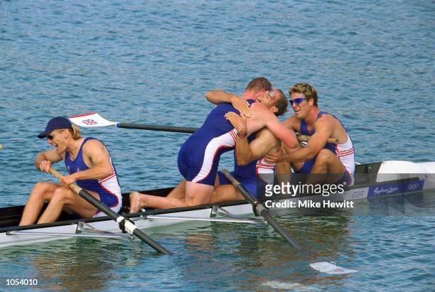 Tim Foster, Matthew Pinsent, Steve Redgrave and James Carcknell of Great Britain celebrate gold in the Men's Coxless Four Rowing Final at the Sydney...
