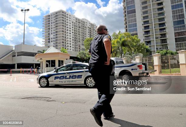 Aventura police in front of the building in Aventura, Calif., Friday, Oct. 26 where the bombing suspect Cesar Sayoc's mother lives.