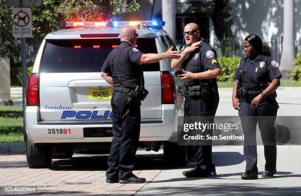 Aventura police in front of the building in Aventura, Calif., Friday, Oct. 26 where the bombing suspect Cesar Sayoc's mother lives.