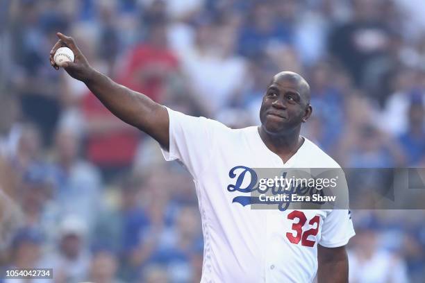Former Los Angeles Lakers player Magic Johnson waves to the fans prior to Game Three of the 2018 World Series between the Los Angeles Dodgers and the...