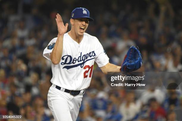 Walker Buehler of the Los Angeles Dodgers reacts after retiring the side during the fourth inning against the Boston Red Sox in Game Three of the...