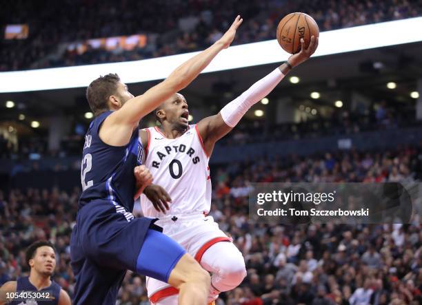 Miles of the Toronto Raptors goes up to the basket as Maxi Kleber of Dallas Mavericks blocks his shot at Scotiabank Arena on October 26, 2018 in...