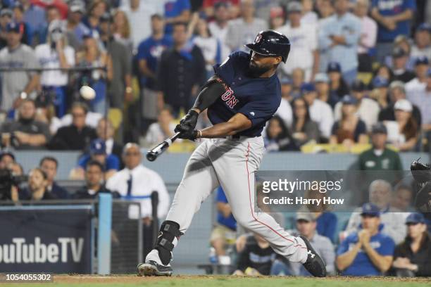 Jackie Bradley Jr. #19 of the Boston Red Sox hits an eighth inning home run against the Los Angeles Dodgers in Game Three of the 2018 World Series at...