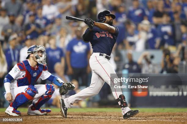 Jackie Bradley Jr. #19 of the Boston Red Sox hits an eighth inning home run against the Los Angeles Dodgers in Game Three of the 2018 World Series at...