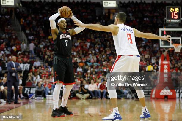 Carmelo Anthony of the Houston Rockets controls the ball defended by Danilo Gallinari of the Los Angeles Clippers in the first half at Toyota Center...