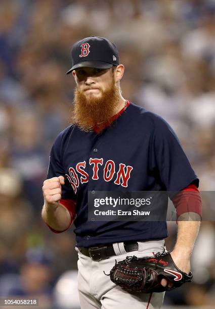 Craig Kimbrel of the Boston Red Sox reacts after retiring the side in the ninth inning against the Los Angeles Dodgers in Game Three of the 2018...