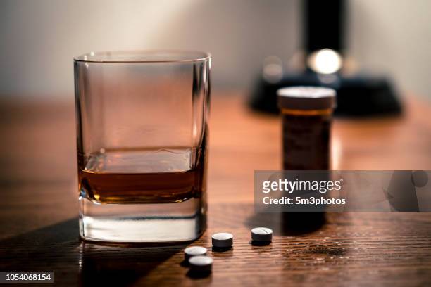 alcohol and opioids a deadly combination - 麻薬 ストックフォトと画像