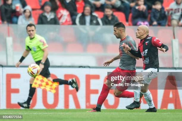 Clemente Rodriguez of Colon and Gonzalo Veron of Independiente battle for the ball during a match between Independiente and Colon as part of...