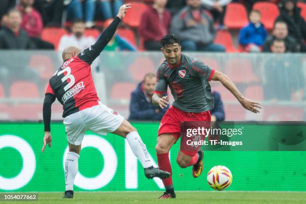 Gonzalo Veron of Independiente and Clemente Rodriguez of Colon battle for the ball during a match between Independiente and Colon as part of...