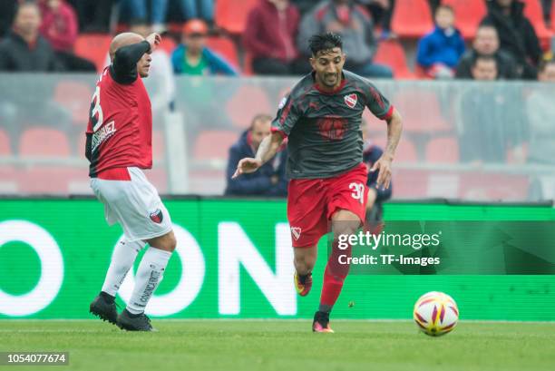 Gonzalo Veron and Clemente Rodriguez of Colon battle for the ball during a match between Independiente and Colon as part of Superliga 2018/19 at...