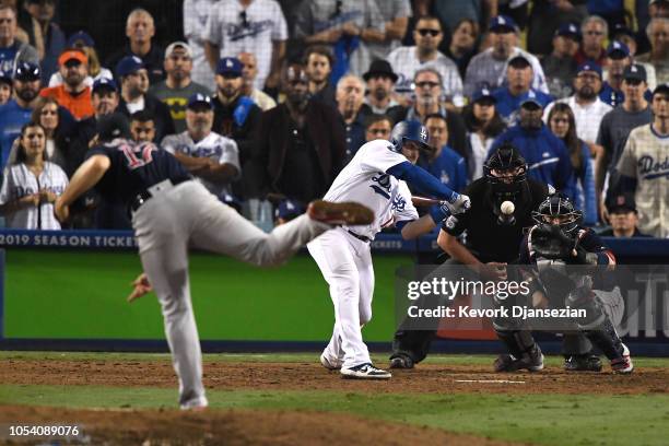 Max Muncy of the Los Angeles Dodgers hits an eighteenth inning walk-off home run on a pitch from Nathan Eovaldi of the Boston Red Sox in Game Three...