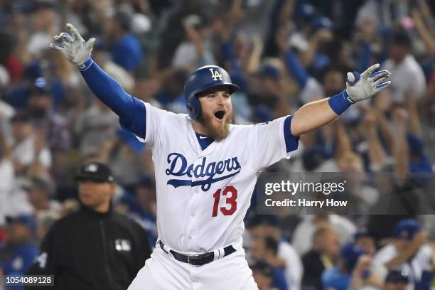 Max Muncy of the Los Angeles Dodgers celebrates his eighteenth inning walk-off home run to defeat the the Boston Red Sox 3-2 in Game Three of the...