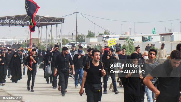 Iranian Shiite Muslim pilgrims enter through the Zurbatiyah border crossing between Iran and Iraq, about 90 kilometres east of the city of Kut, on...