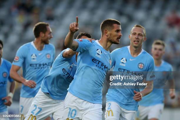 Dario Vidosic of Melbourne City celebrates his goal with team mates during the round two A-League match between the Central Coast Mariners and...