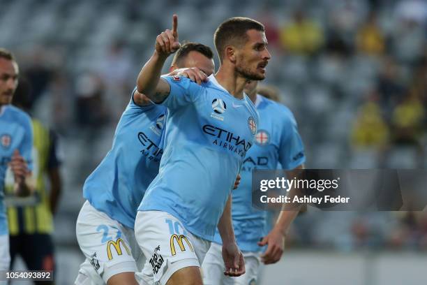 Dario Vidosic of Melbourne City celebrates his goal with team mates during the round two A-League match between the Central Coast Mariners and...