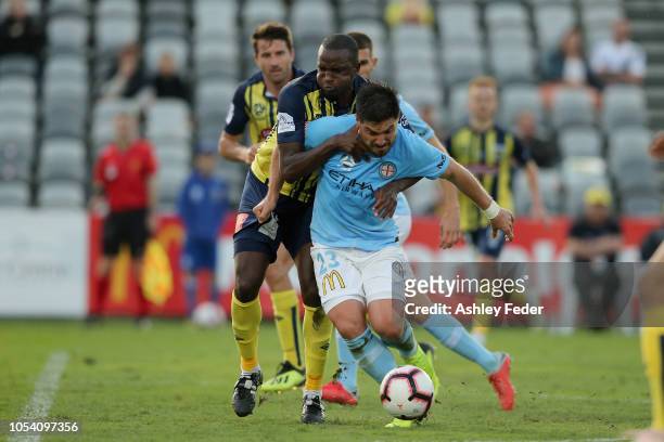 Bruno Fornaroli of Melbourne City contests the ball against Kalifa Cisse of the Mariners during the round two A-League match between the Central...