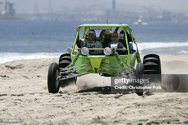 Nelly and Murphy Lee drive a dunebuggy to the MTV "Summer on the Run" Beach House 2004