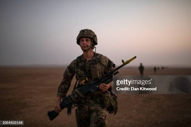 Soldiers from 40 Commando, Royal Marines walk towards their objective during exercise 'Saif Sareea 3' on October 24, 2018 in Duqm, Oman. 2018 has...