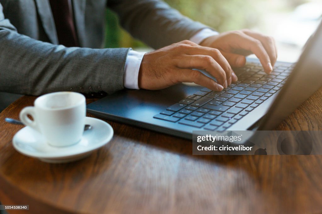 Close up of hands on laptop