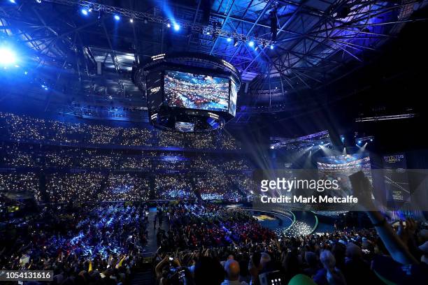 The crowd shine phone torchlights during a performance by Birds of Tokyo the 2018 Invictus Games Closing Ceremony at Qudos Bank Arena on October 27,...