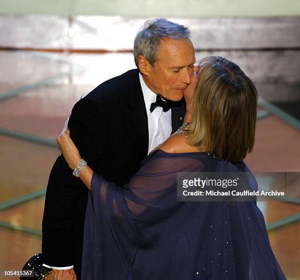 Clint Eastwood, winner Best Picture for "Million Dollar Baby", hugs Barbra Streisand, presenter