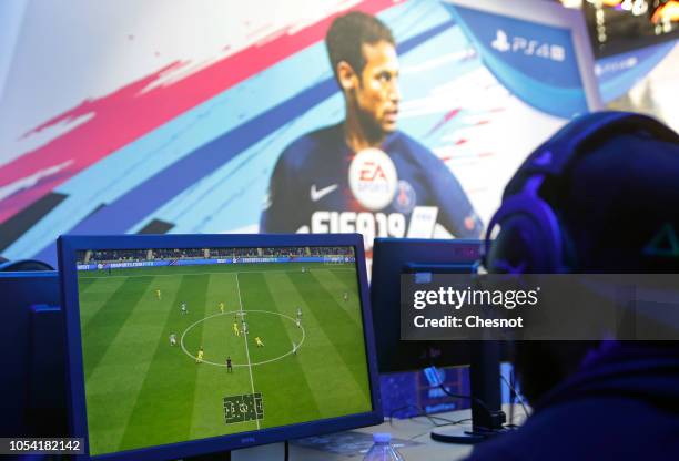 Gamer plays the video game 'Fifa 19' developed and published by Electronic Arts on a Sony PlayStation game consoles PS4 Pro during the 'Paris Games...