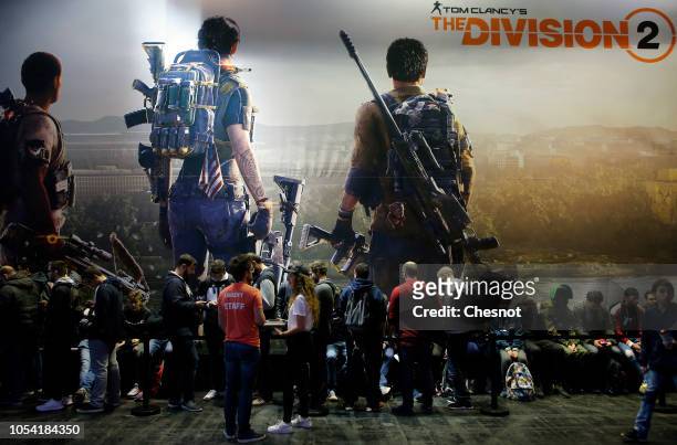 Visitors queue to play the video game 'Tom Clancy's The Division 2' developed by Massive Entertainment and published by Ubisoft during the 'Paris...