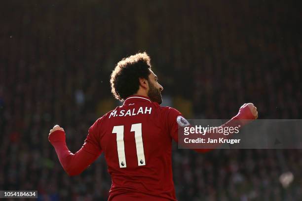Mohamed Salah of Liverpool celebrates after scoring his team's first goal during the Premier League match between Liverpool FC and Cardiff City at...