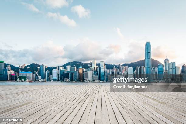seaside boardwalk,victoria harbor,hong kong - hong kong skyline stock pictures, royalty-free photos & images