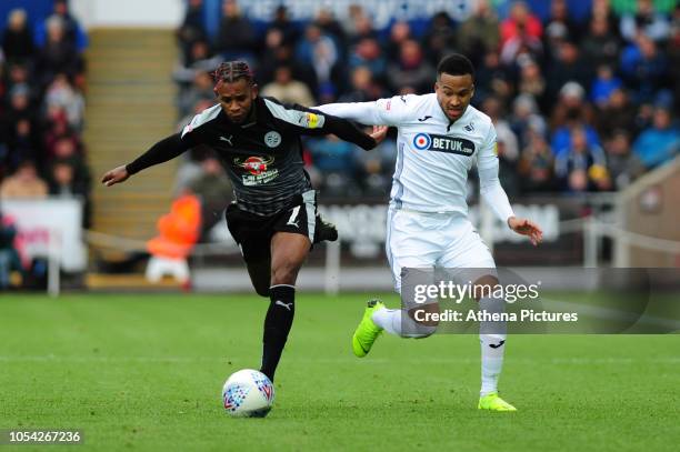 Leandro Bacuna of Reading vies for possession with Martin Olsson of Swansea City during the Sky Bet Championship match between Swansea City and...