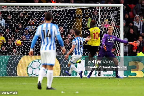 Isaac Success of Watford scores his team's third goal during the Premier League match between Watford FC and Huddersfield Town at Vicarage Road on...