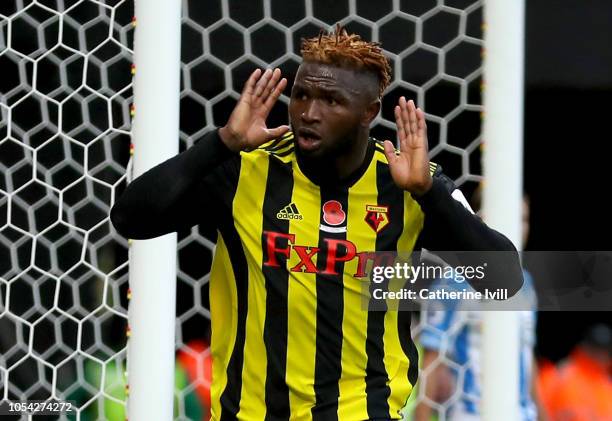 Isaac Success of Watford celebrates after scoring his team's third goal during the Premier League match between Watford FC and Huddersfield Town at...
