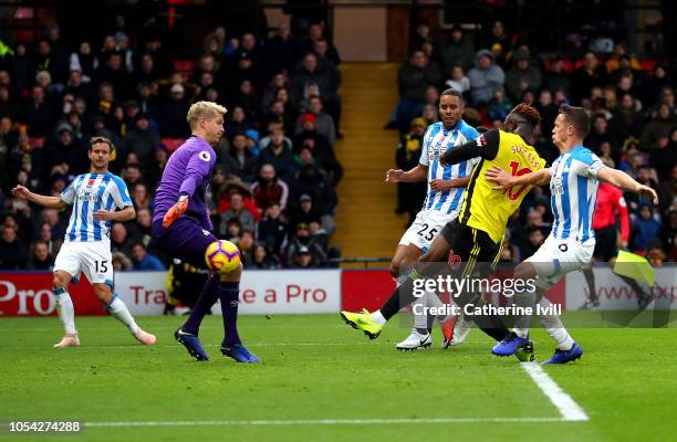 Isaac Success of Watford scores his team's third goal during the Premier League match between Watford FC and Huddersfield Town at Vicarage Road on...