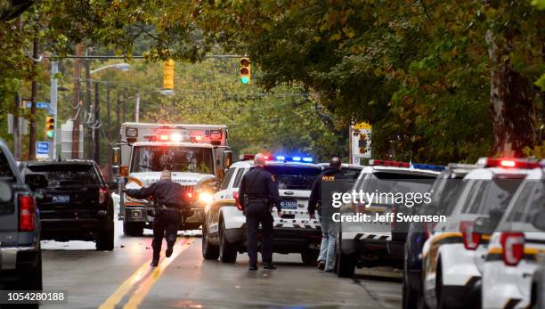 Police rapid response team members respond to the site of a mass shooting at the Tree of Life Synagogue in the Squirrel Hill neighborhood on October...