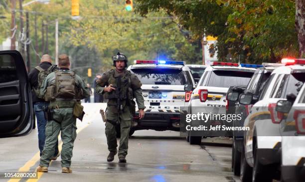 Police rapid response team members respond to the site of a mass shooting at the Tree of Life Synagogue in the Squirrel Hill neighborhood on October...