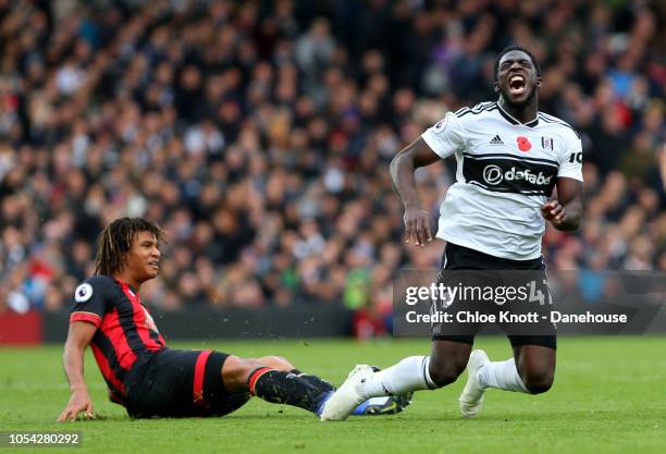 Aboubakar Kamara of Fulham goes down after a challenge from Nathan Ake of Bournemouth during the Premier League match between Fulham FC and AFC...