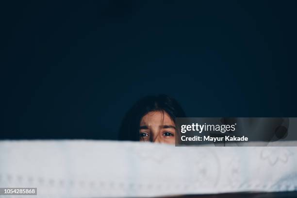 frightened girl hiding herself - children violence stock pictures, royalty-free photos & images