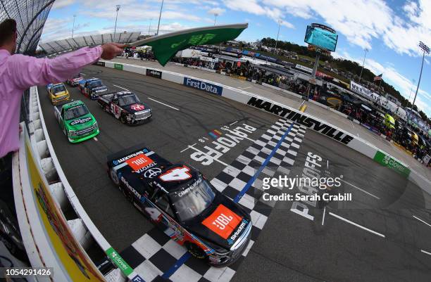 Todd Gilliland, driver of the JBL/SiriusXM Toyota, leads the field to the green flag to start the NASCAR Camping World Truck Series Texas Roadhouse...