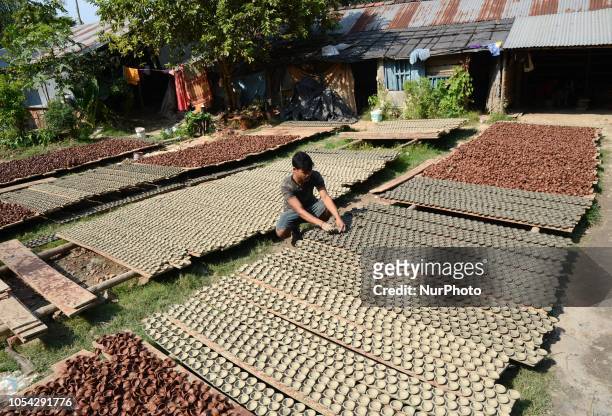 Indian worker prepares Diyas or Earthen Lamp at a workshop for the upcoming Diwali festival on the outskirts of Kolkata , India on Saturday , 27th...