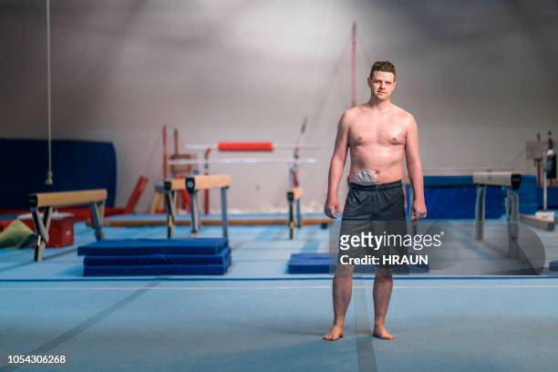 confident sportsman with stoma bag at gym - artistic gymnastics stock pictures, royalty-free photos & images