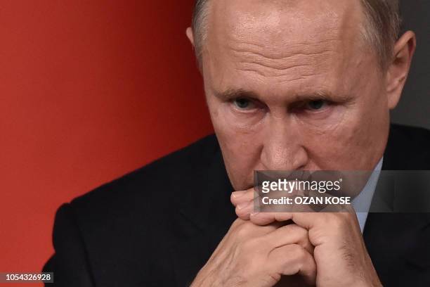Russian President Vladimir Putin attends a conference as part of a summit called to attempt to find a lasting political solution to the civil war in...