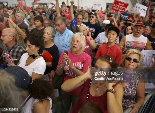 In this file picture from 2017, Cesar Sayoc is seen as President Donald Trump speaks during a campaign rally at the AeroMod International hangar at...