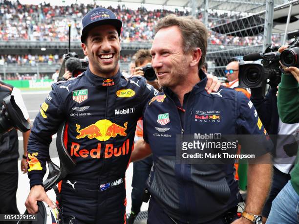 Pole position qualifier Daniel Ricciardo of Australia and Red Bull Racing celebrates with Red Bull Racing Team Principal Christian Horner in parc...