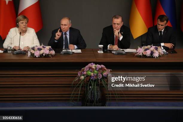 German Chancellor Angela Merkel, Russian President Vladimir Putin, Turkish President Recep Tayyip Erdogan and French President Emmanuel Macron attend...