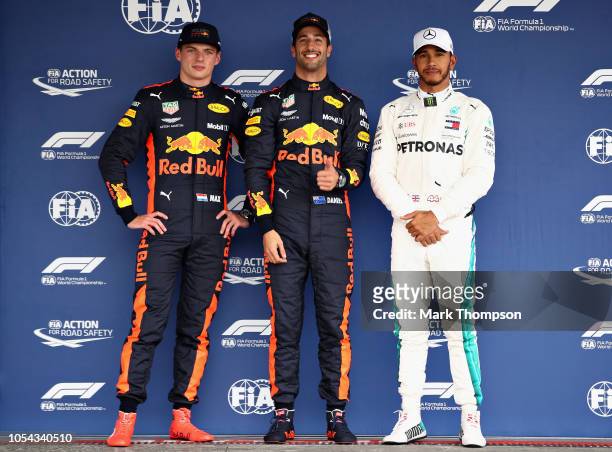 Top three qualifiers Daniel Ricciardo of Australia and Red Bull Racing, Max Verstappen of Netherlands and Red Bull Racing and Lewis Hamilton of Great...