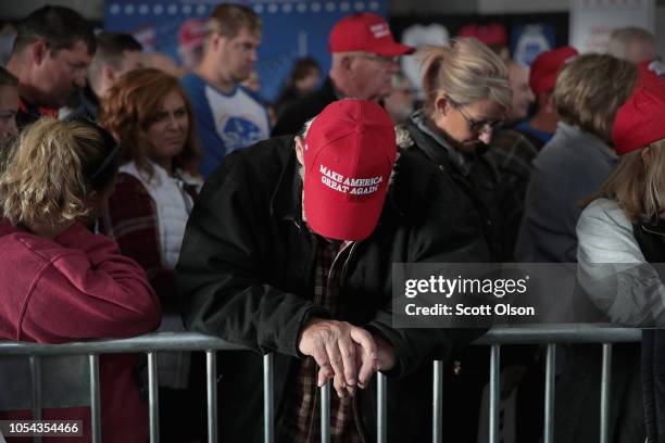 Supporters of President Donald Trump listen as the victims of today's shooting at the Tree of Life synagogue in Pittsburgh are remembered in prayer...