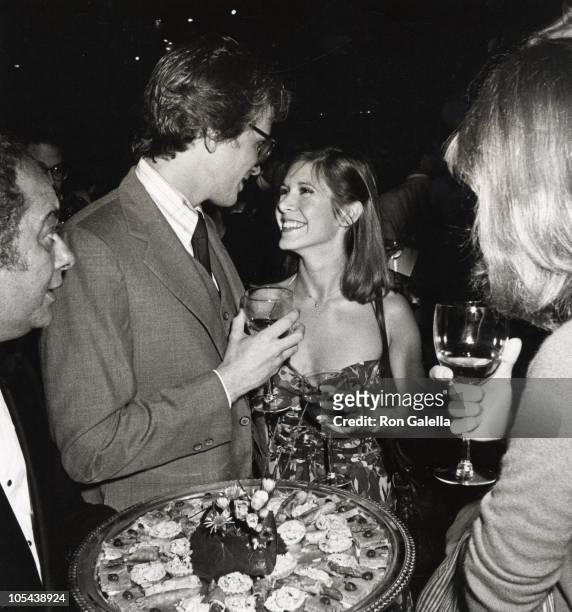 Burt Young,Peter Weller, Carrie Fisher and guest during Giorgio Armani Fashion Show - September 19, 1980 at RCA Promenade in New York City, New York,...