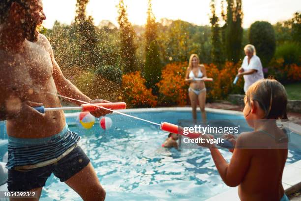 family water fight - kids splashing stock pictures, royalty-free photos & images